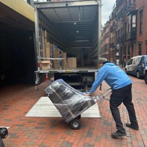 Unloading, Furniture Dolly, Hand Truck, Movers, and Moving Truck from Binding Moving and Storage uploaded 10:38 AM on Mar 1st, 2026